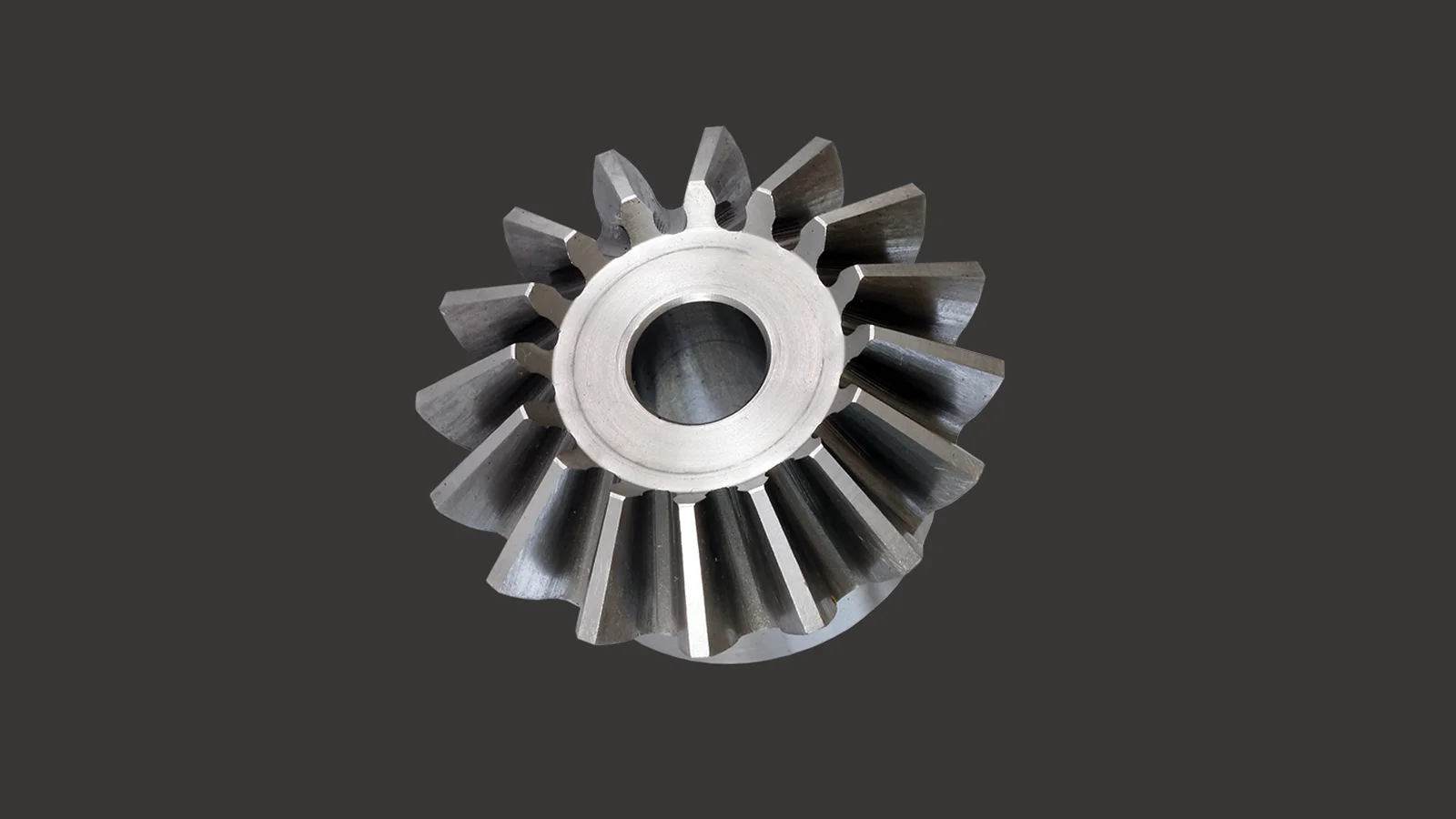 Steel bevel gear with straight teeth, conical gear ring, oblique top view