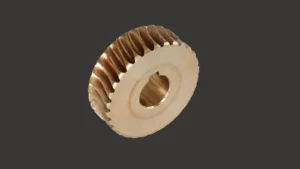 Brass worm gear with helical teeth and a central bore, side view